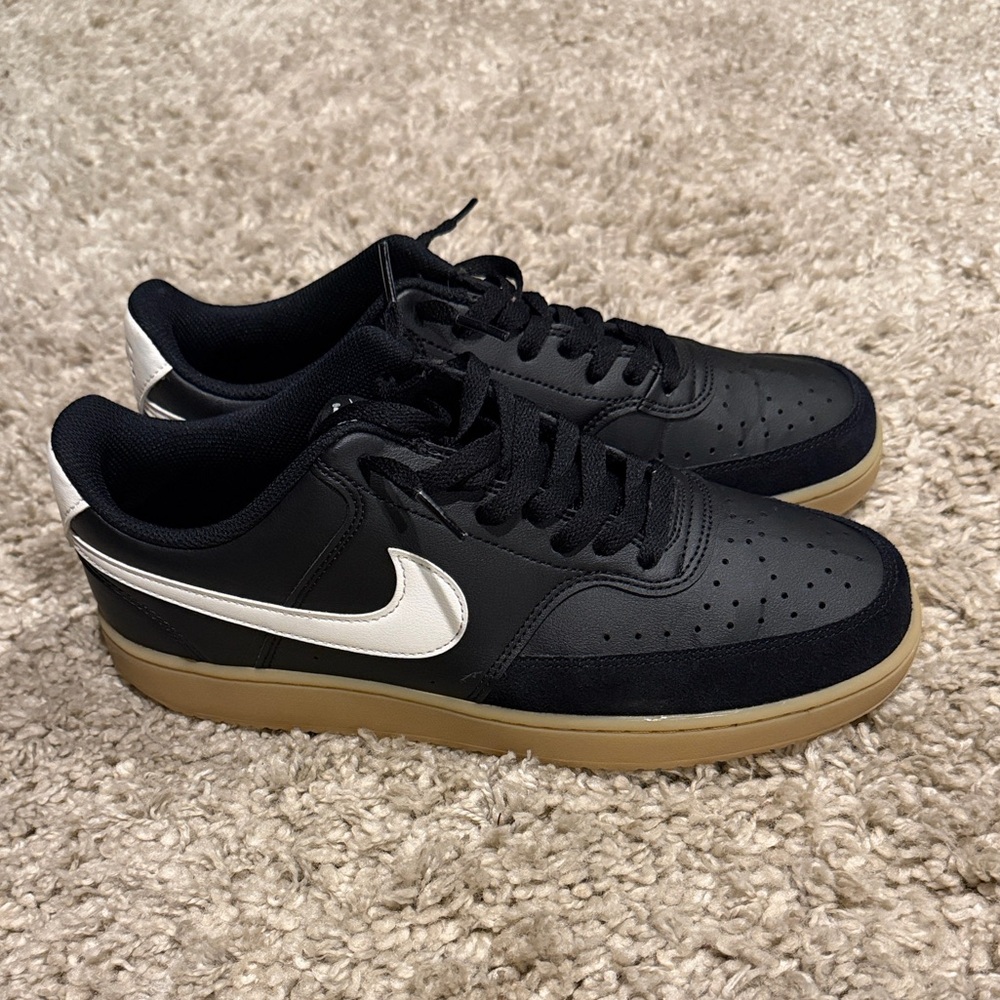 Black Low-Top Sneakers with White Swoosh and Gum Sole